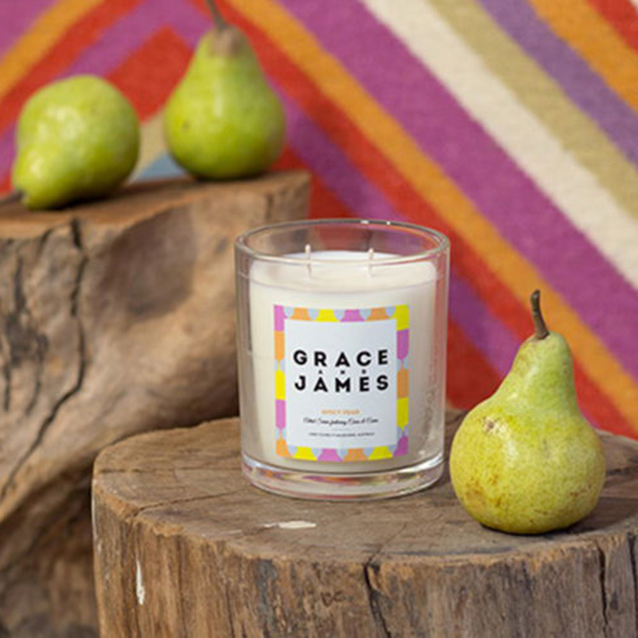 Fun, colorful candle label design on small glass jar