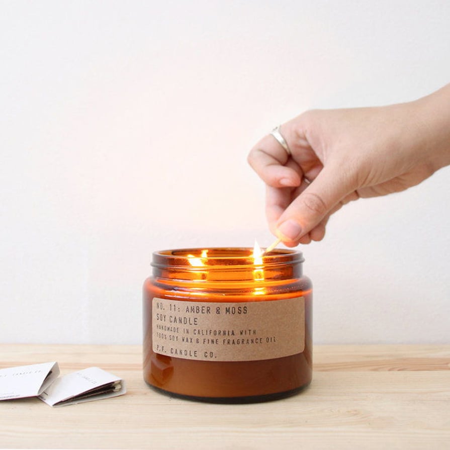 Amber candle jar with brown kraft label and simple typewriter font