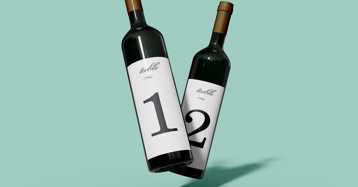 Dark wine bottles with table number labels